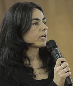 Marta Soler speaking with microphone